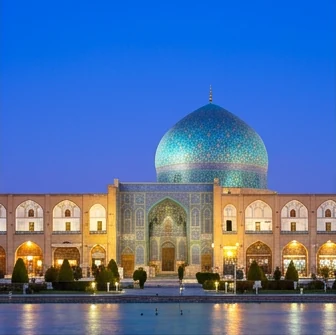 A turquoise mosque dome in Isfahan at blue hour